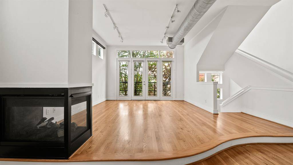Bright and inviting living room filled with natural light, creating a warm and open atmosphere.