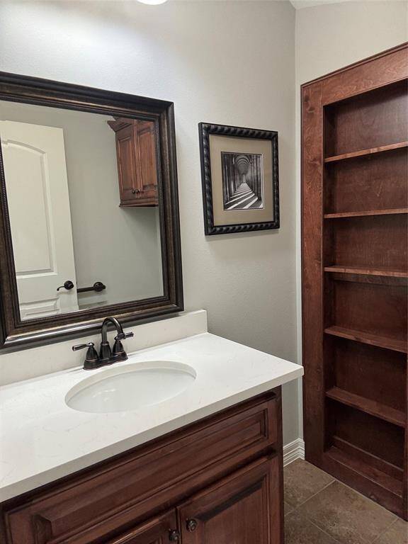 Convenient half bath enhancing the downstairs living area with newly installed quartz countertops and new sink.