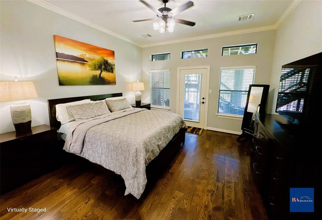 Spacious downstairs primary bedroom with direct porch access.