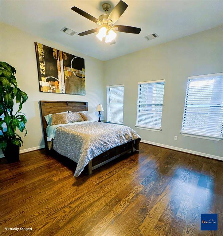 Spacious upstairs bedroom offering comfort and privacy.