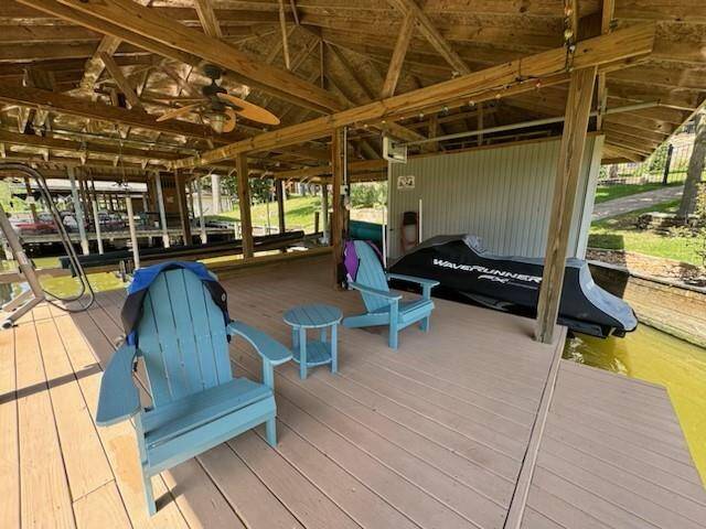 Experience waterfront luxury with a swim deck, boat lift, jet ski lift, and convenient metal stairs at the boathouse.