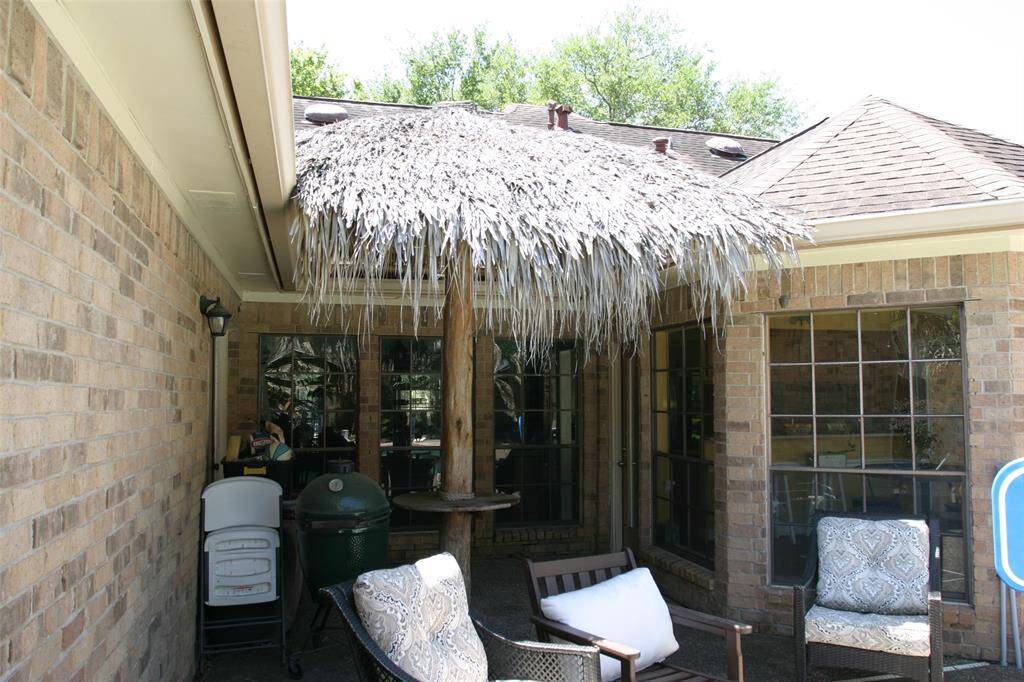 Backyard w/grass behind garage.
