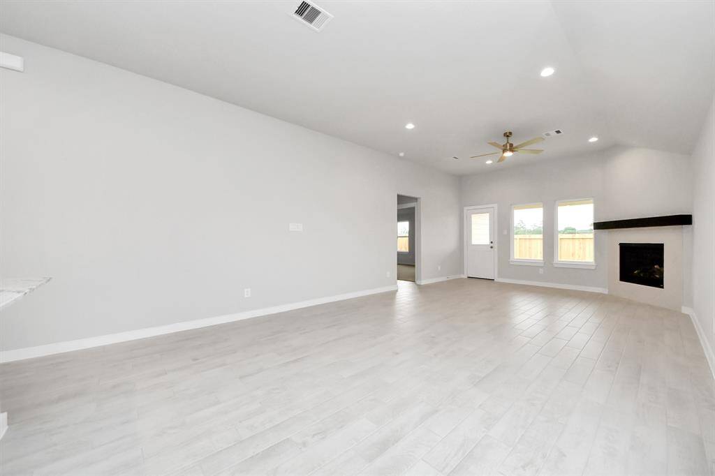 Embrace the warmth and comfort of this inviting family room, flooded with natural light!