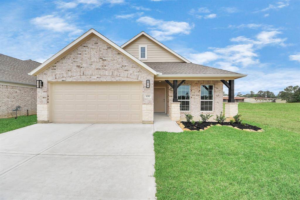 Home features a convenient 2-car garage complemented by a spacious driveway, offering ample parking for you and your guests.