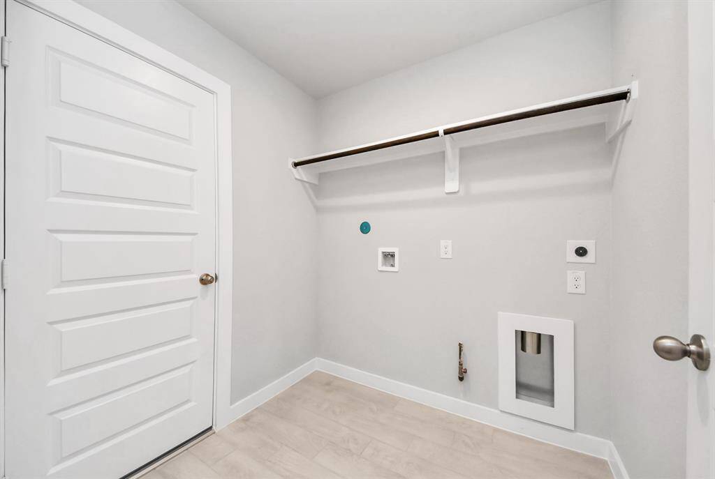 A perfect blend of functionality and comfort. Capture the essence of easy living with a first-floor laundry room, thoughtfully equipped with shelving for effortless organization. Both electric and gas connections available.