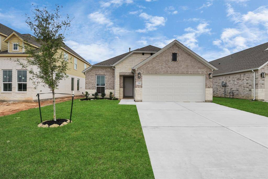Home features a convenient 2-car garage complemented by a spacious driveway, offering ample parking for you and your guests.
