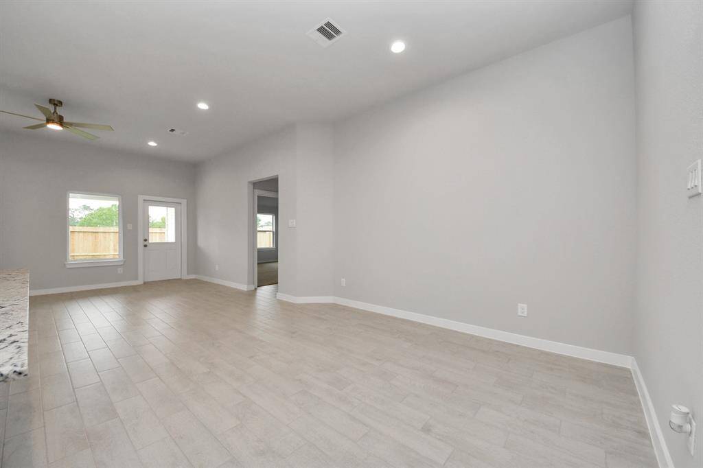 Make memories gathered around the table with your family and friends! This spacious dining room features elegant flooring, custom paint, and adjacent to family room and kitchen for open concept feel.