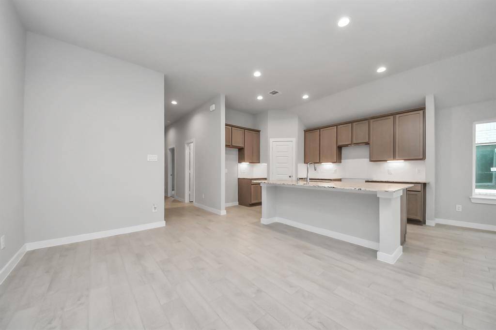 An inviting dining space seamlessly woven into the open concept, connecting the family room and kitchen.