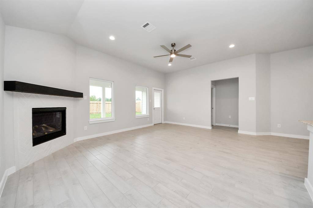 Embrace the warmth and comfort of this inviting family room, flooded with natural light!