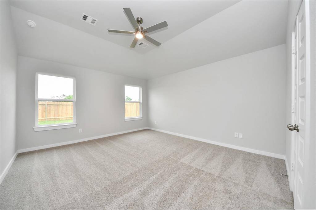 Another perspective unveils a comprehensive view of the serenity and comfort this primary suite offers