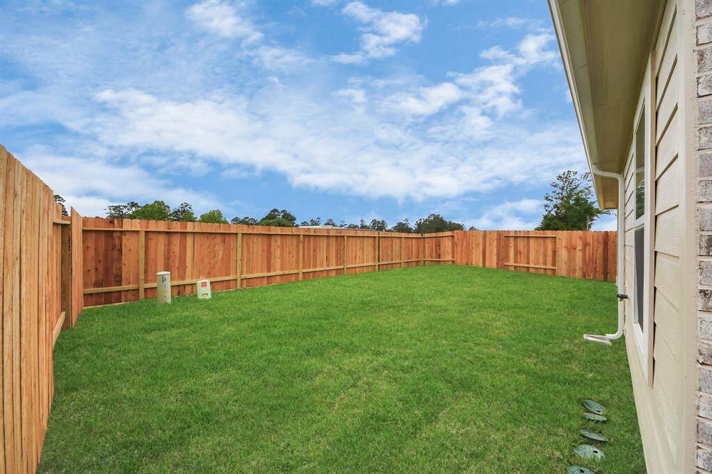 Backyard retreat, offering an abundance of space for kids to play and explore. The possibilities are endless in this outdoor haven, where the joy of open-air activities and family gatherings awaits.