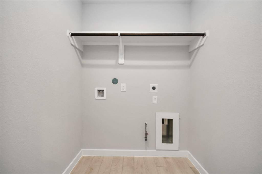 A perfect blend of functionality and comfort. Capture the essence of easy living with a first-floor laundry room, thoughtfully equipped with shelving for effortless organization. Both electric and gas connections available.