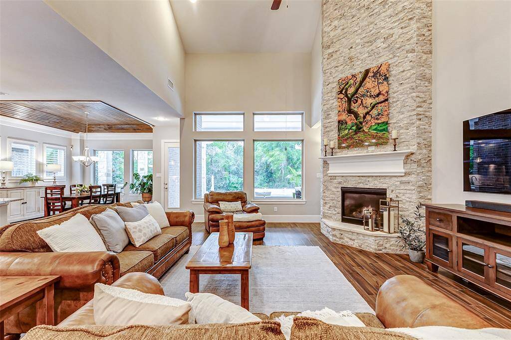 Let your gaze drift to the picture windows that line one wall, offering stunning views of your gorgeous backyard oasis. With ample space for furniture and an area perfect for a media unit and large TV, this living room is designed for both relaxation and entertainment.