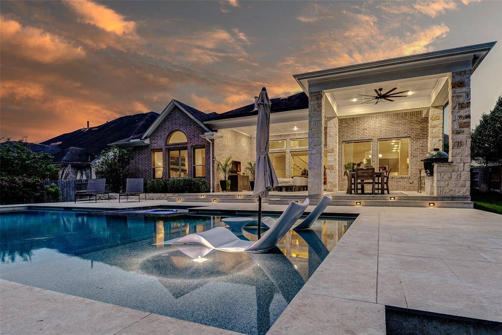 Your private outdoor oasis awaits! This expansive, resort-style pool and spa offers the ultimate blend of luxury and relaxation. The sprawling covered patio, seamlessly integrated with the home, features a built-in outdoor kitchen and ample seating—perfect for effortless entertaining or unwinding in style.