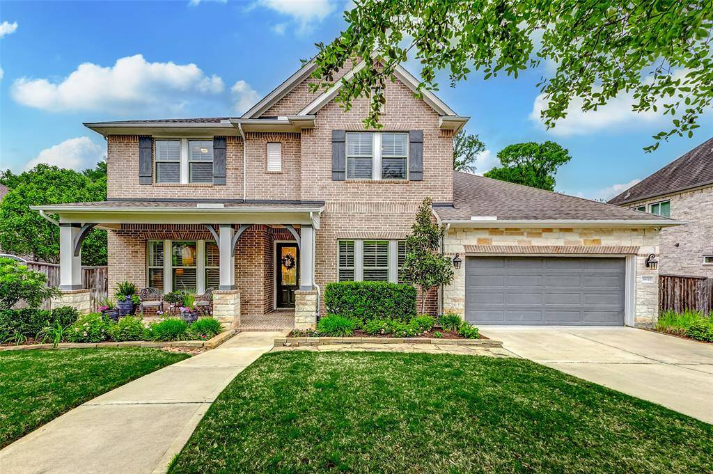Follow the beautifullylandscaped pathway to the invitingfront porch, elegantly framed inbrick. As you arrive, a stunning glass leaded front door welcomes youinside, setting the stage for theelegance and charm that awaitswithin.