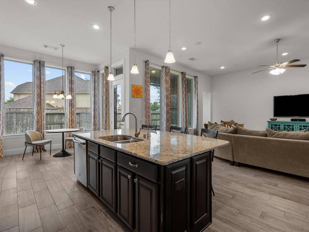 The kitchen island is large enough to cater to your guests.