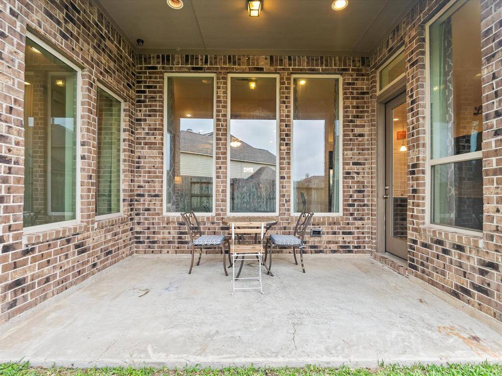 The covered patio area is perfect for relaxing and back yard BBQing!