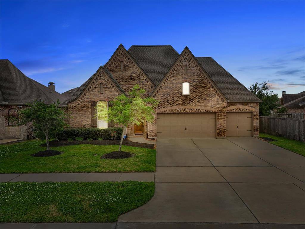 Red Agave features a brick facade and a spacious three-car garage.