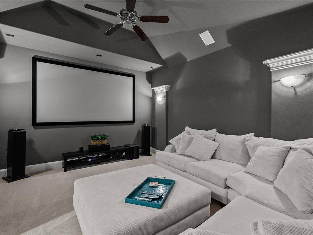 Large media room is a fantastic spot to watch movies or play games.