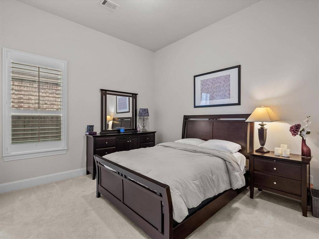 Another feature of this beautiful home are the plantation shutters! This room is big enough for multiple pieces of furniture.