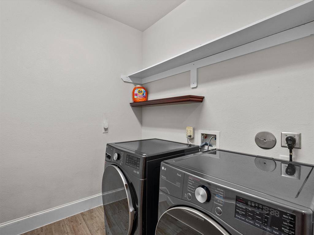 The laundry room is big enoughfor large appliances and enjoys wall storage.
