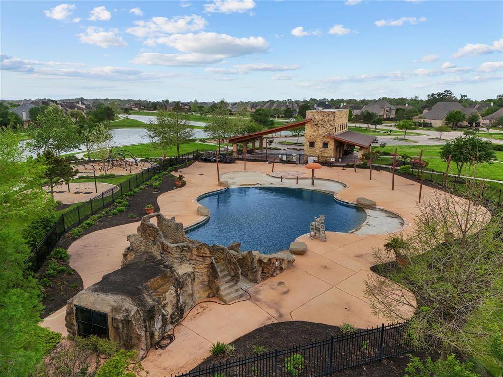 The well maintained community swimming pool will be the hub of your lazy summer days.