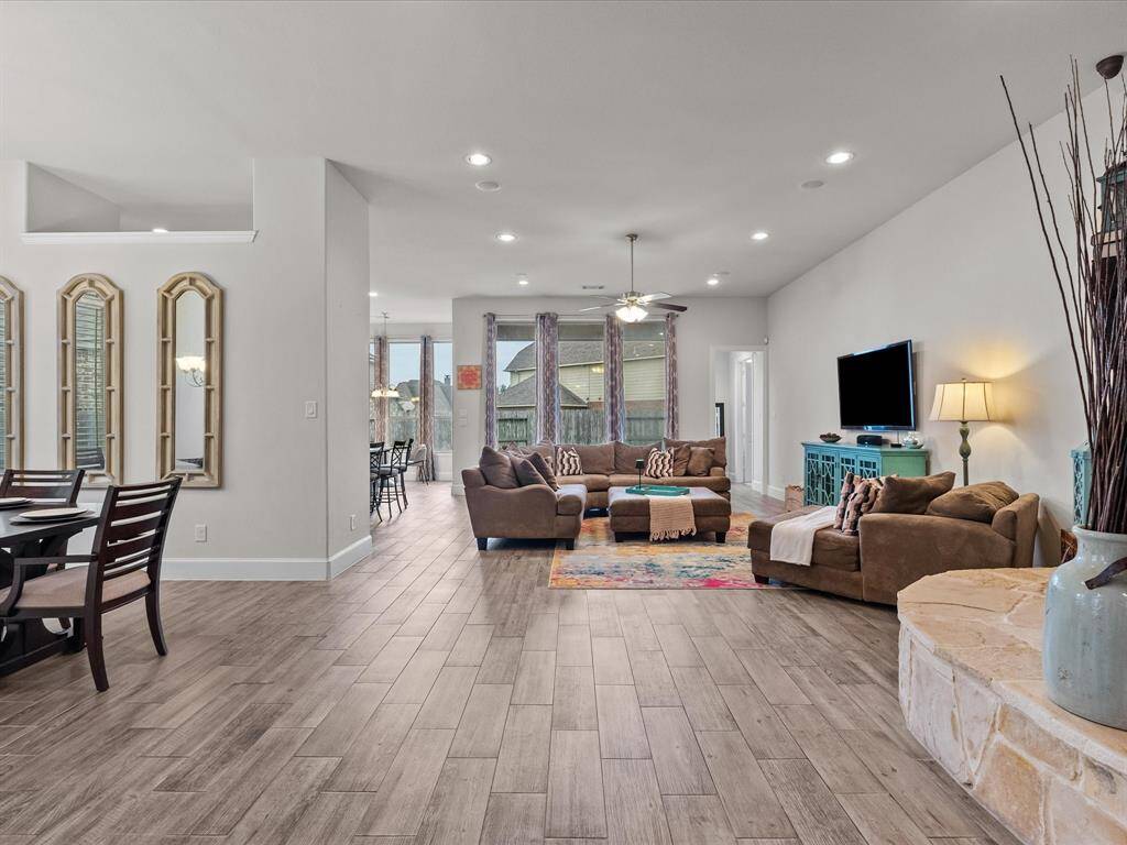 Beautiful wood-look tile flooring throughout the house.