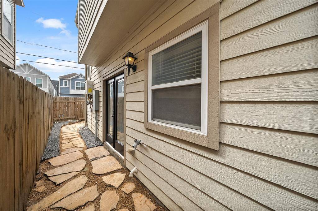 Just off the kitchen, double doors open to pavers that lead to your private yard.
