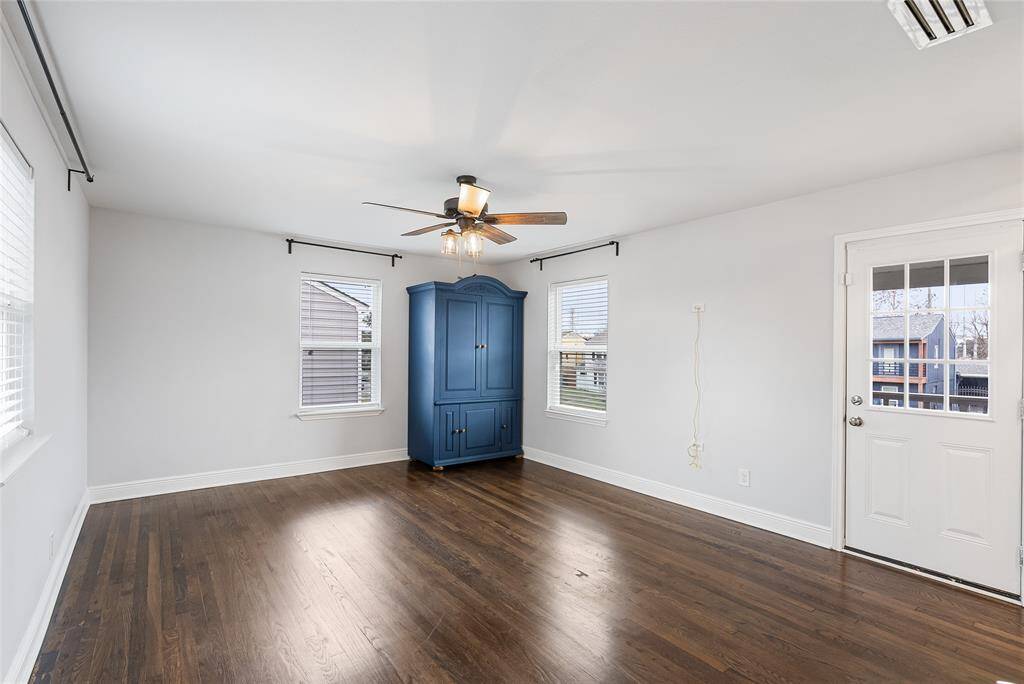 The primary bedroom is filled with natural light, and offers plenty of space for your personal items!