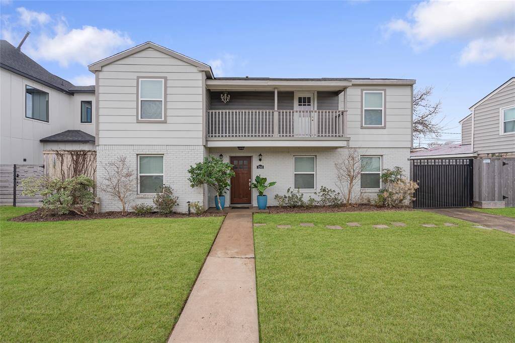 Charming landscaping and brick exterior welcome you home everyday! There is also a driveway gate leading to a two car garage.