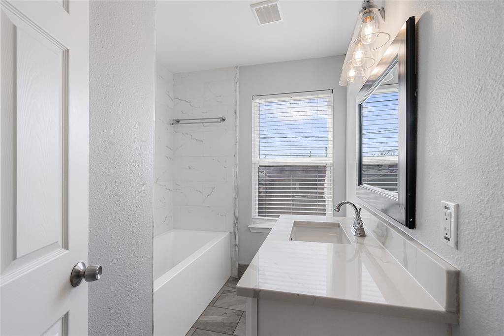 The secondary bathroom echoes the sophisticated touches found throughout the home!