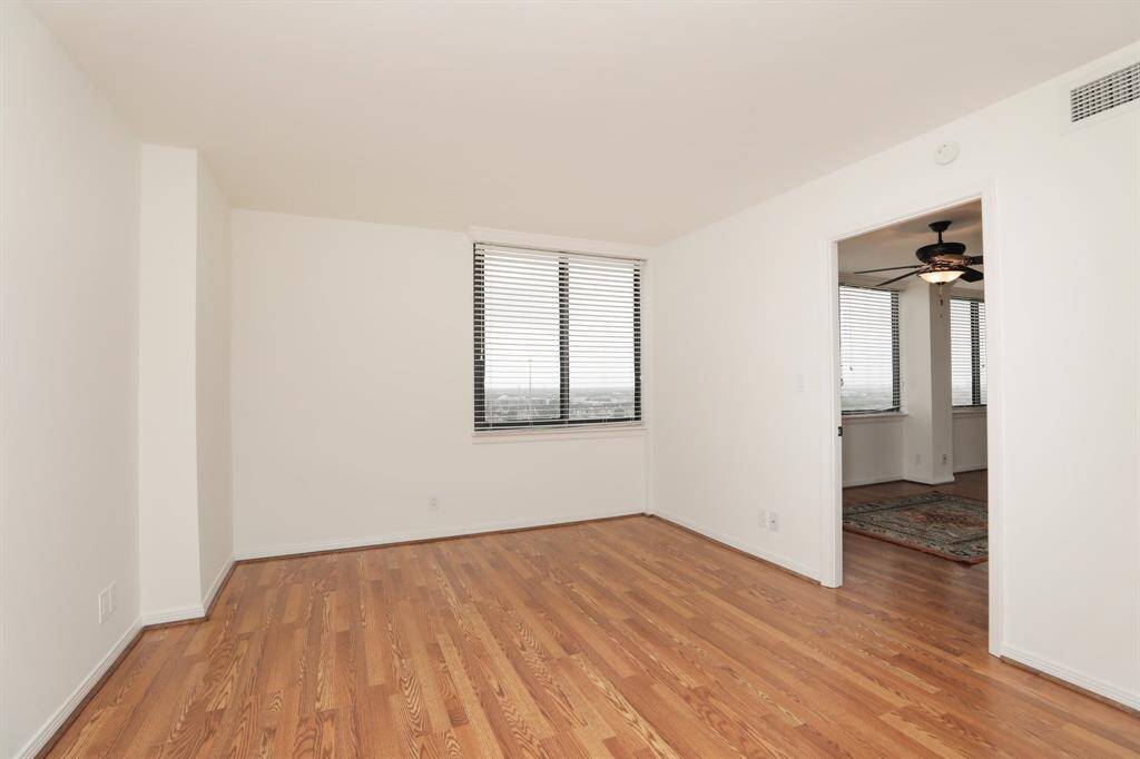 Primary bedroom located off of dining area.  Tons of wall space for furniture placement.