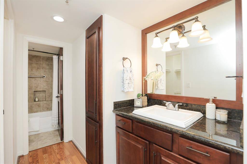 Extra large vanity with linen closet and built in hamper.  Upgraded hardware throughout.