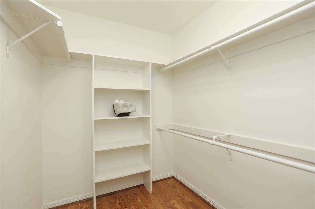 Take a look at this walk in closet with built in shelving!