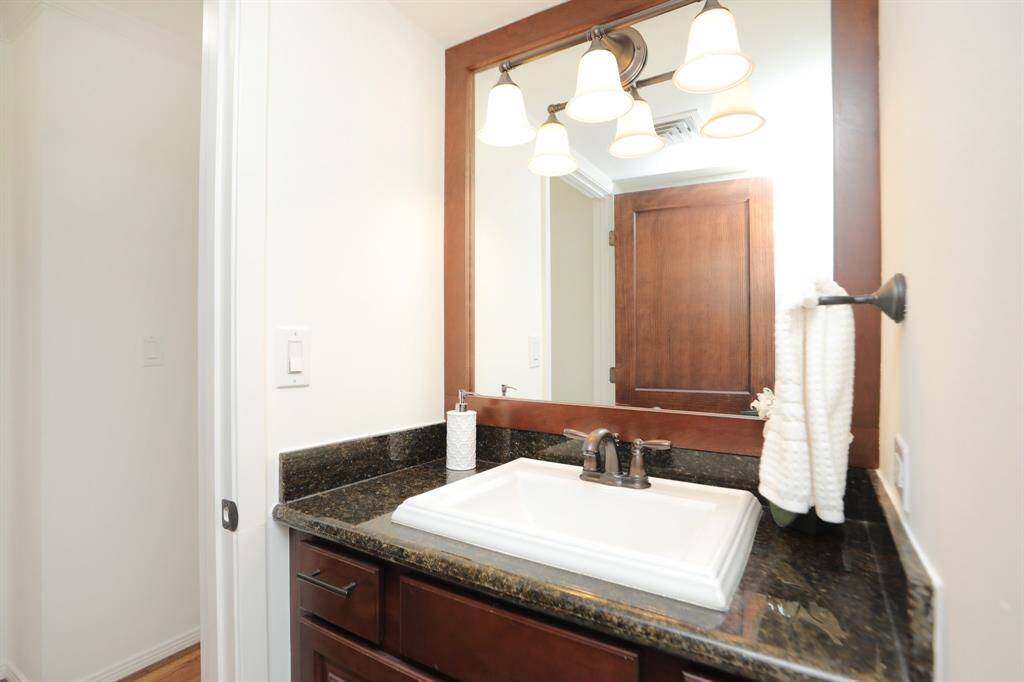 Lovely bathroom with lovely warm finishes like the rest of the condo.