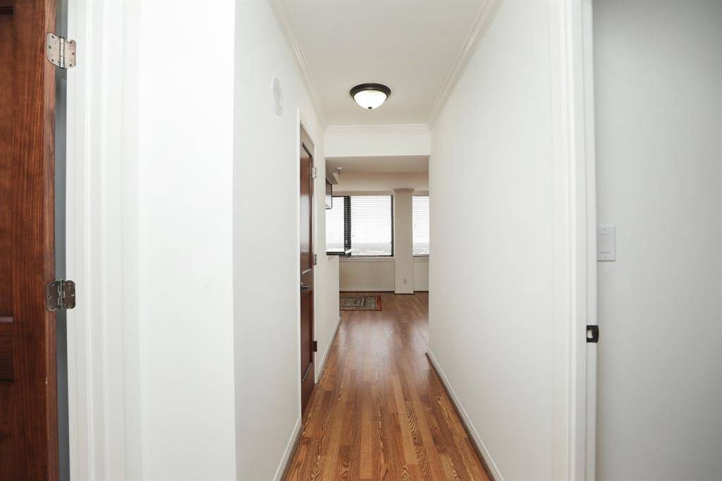 Private entry with great wall space for your favorite art work. You will notice the updated quality of all things in this beautiful condo from doors, lighting, hardware, flooring, paint, backsplash etc.