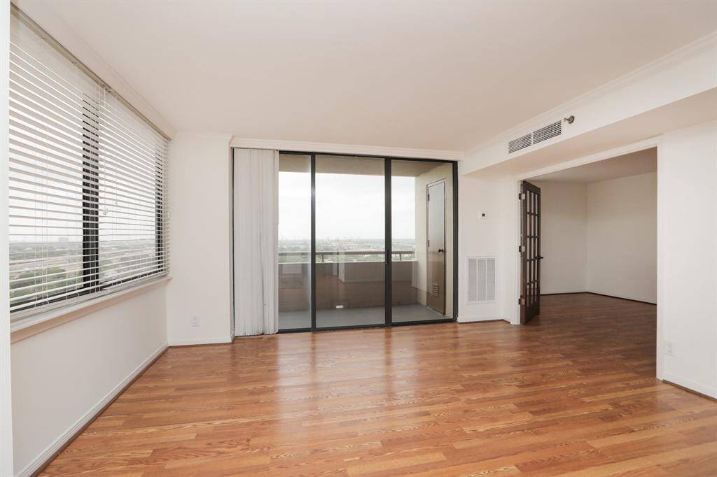 Great living space to arrange to your liking.  Second bedroom has an extra set of french doors in the event one would like a study that can open up to living.