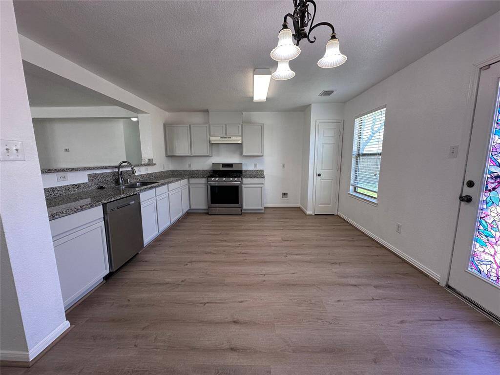 Large Kitchen featuring Granite Counters & Stainless Steel Appliances