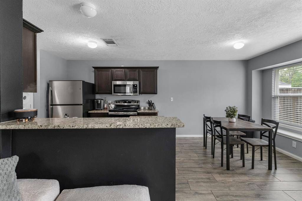 View of the kitchen and breakfast area from the family room.
