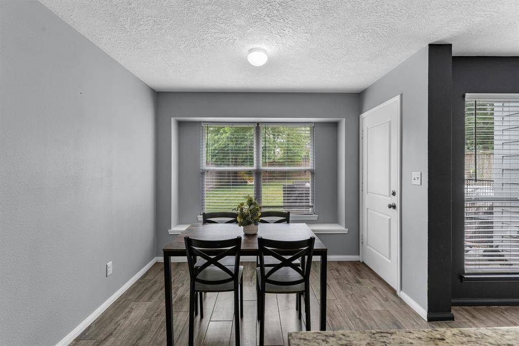 The breakfast area has beautiful views of the huge backyard and features a quaint window seat.