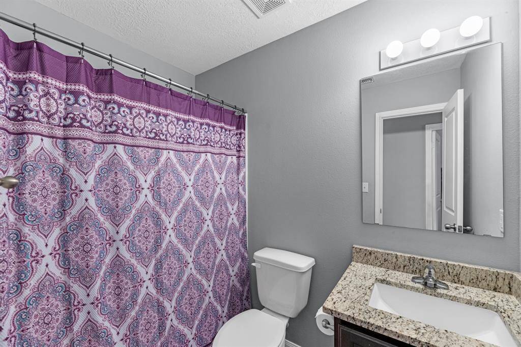 This full bathroom is located between bedrooms #2 and #3.