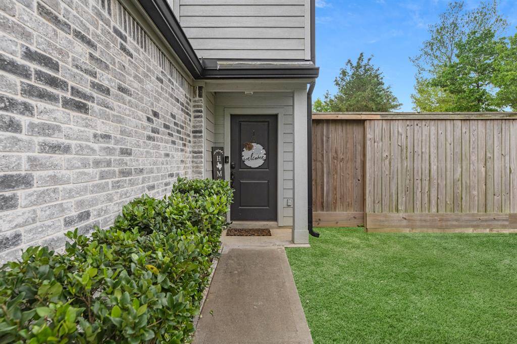 Recent privacy fence and a welcoming entrance.