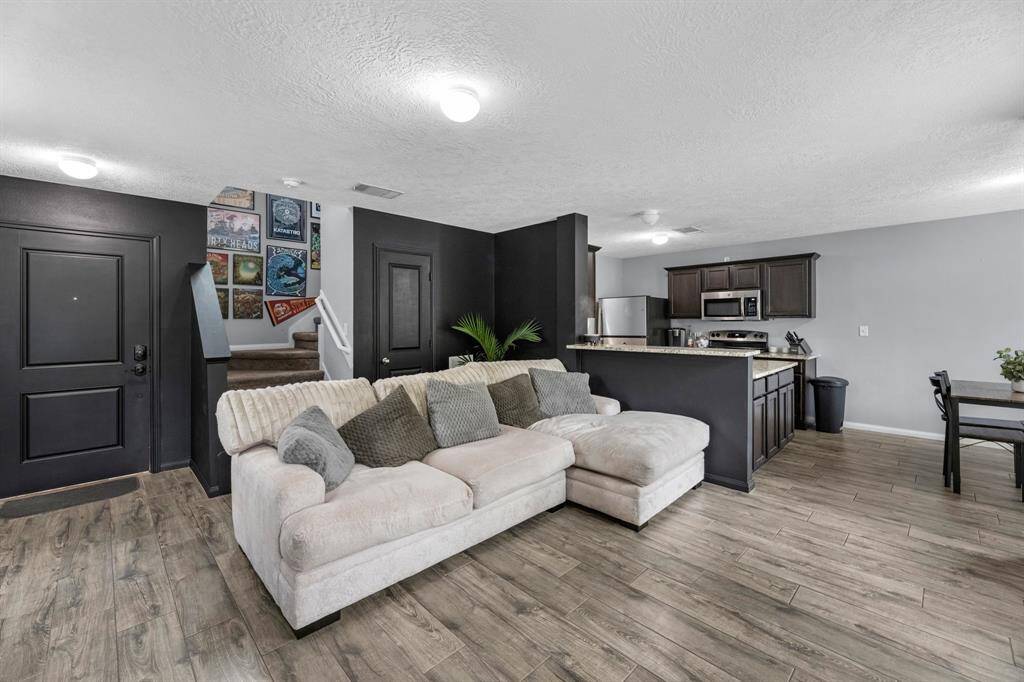 Step inside and you are greeted with recent hard flooring & paint.