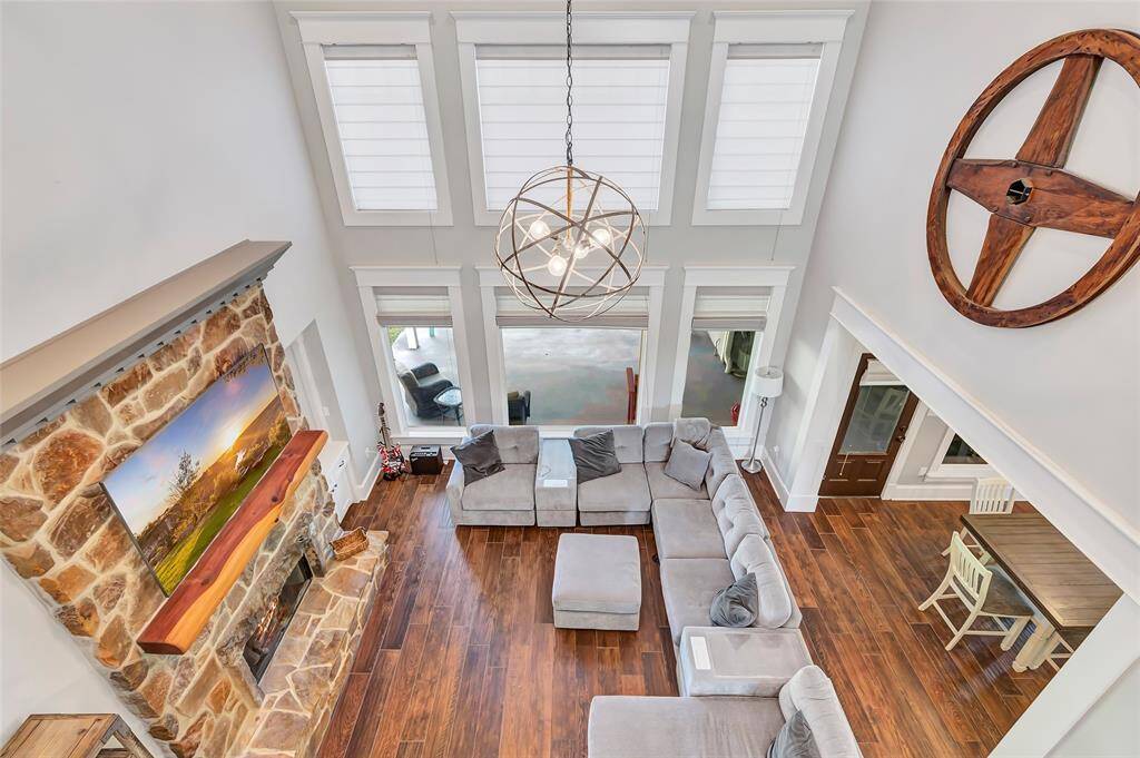 Stunning aerial view from the staircase showcasing a spacious living area with elegant design and abundant natural light.