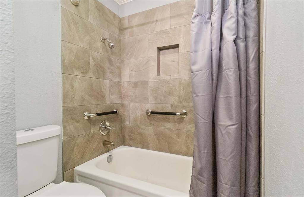 Spacious master bedroom with beautiful crown moldings and huge windows that allow tons of natural light.