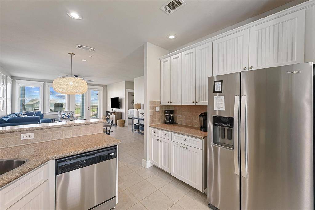 Enjoy views of the open living and dining areas while preparing meals, making it easy to stay connected with guests and family.