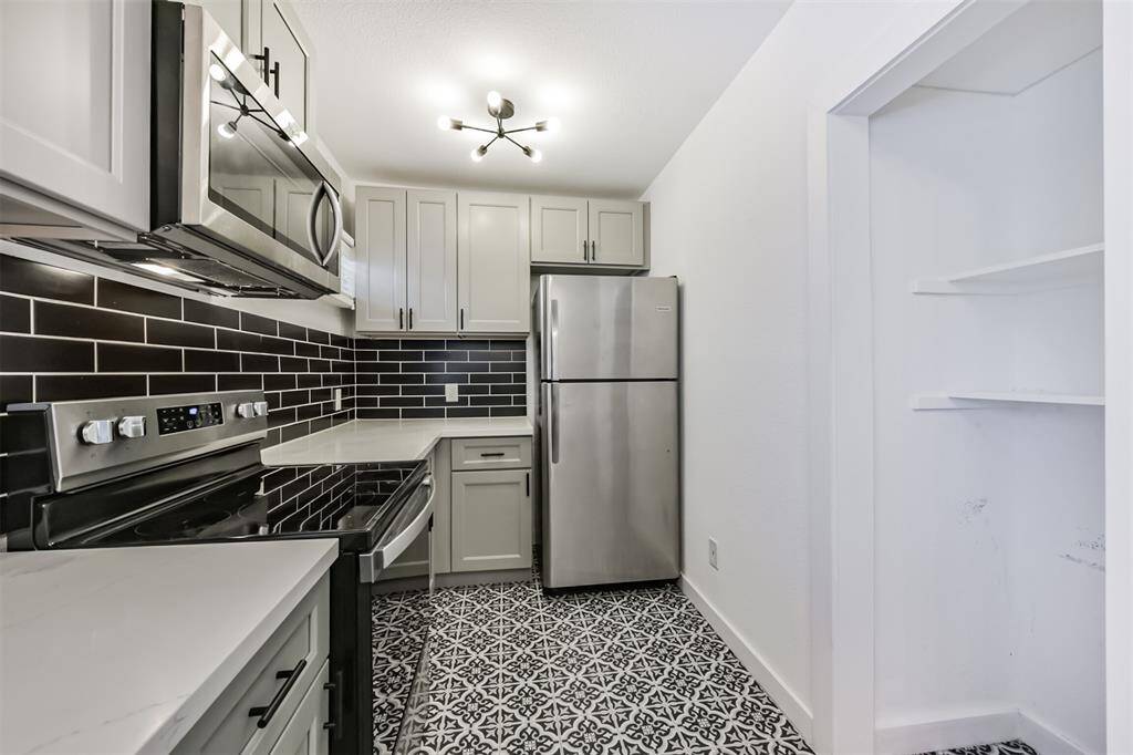 An example of an updated kitchen. SS appliances are installed in each unit.