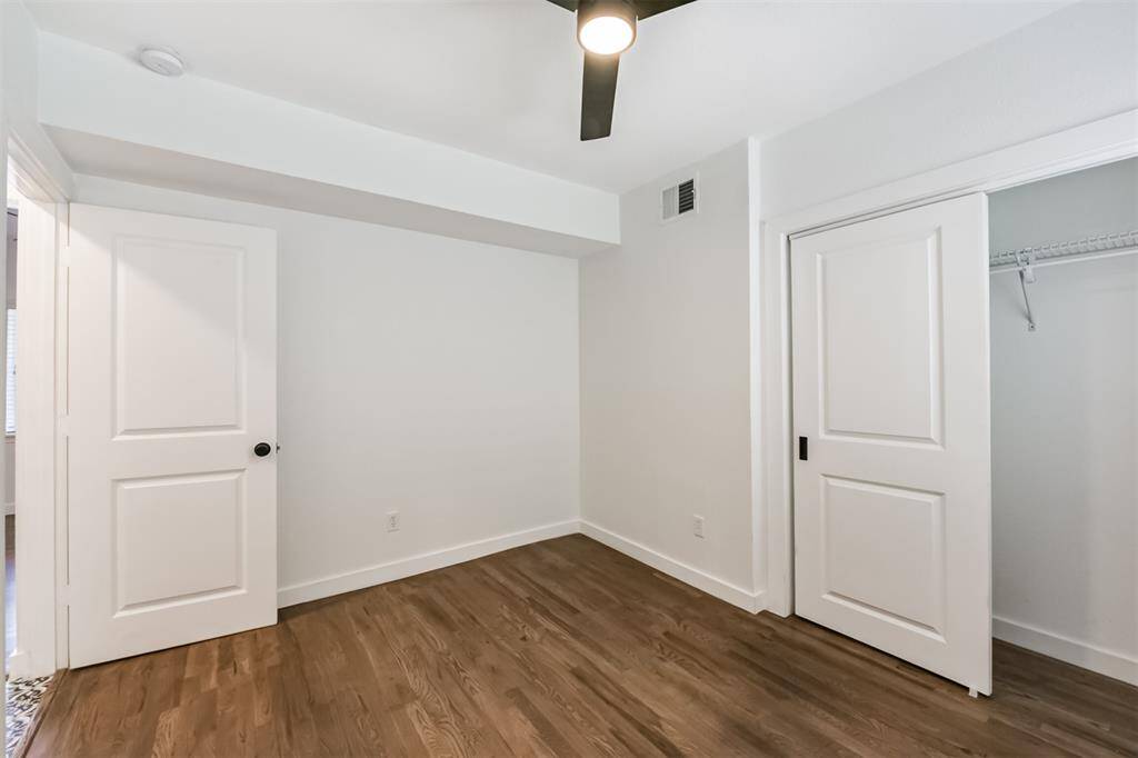 The bedroom in a 1 bedroom unit with all paneled doors.
