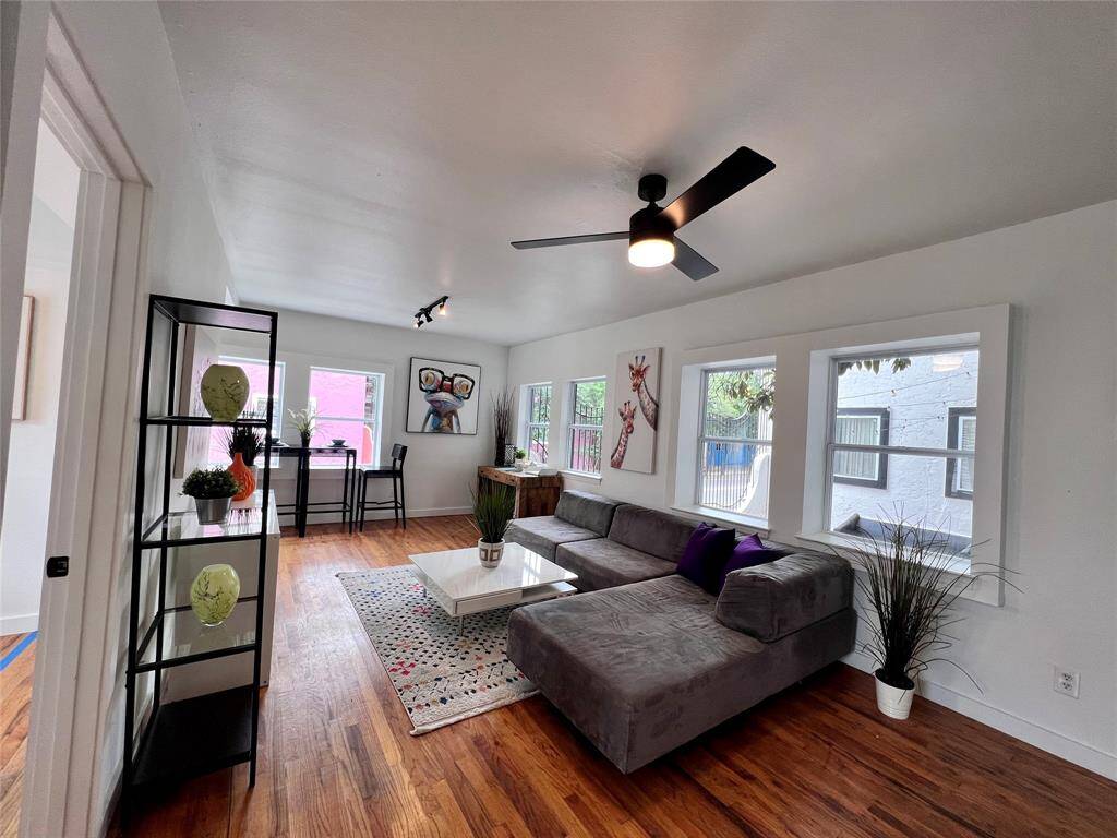This shows the living space and wood floors in the unit/s. Efficient yet inviting.