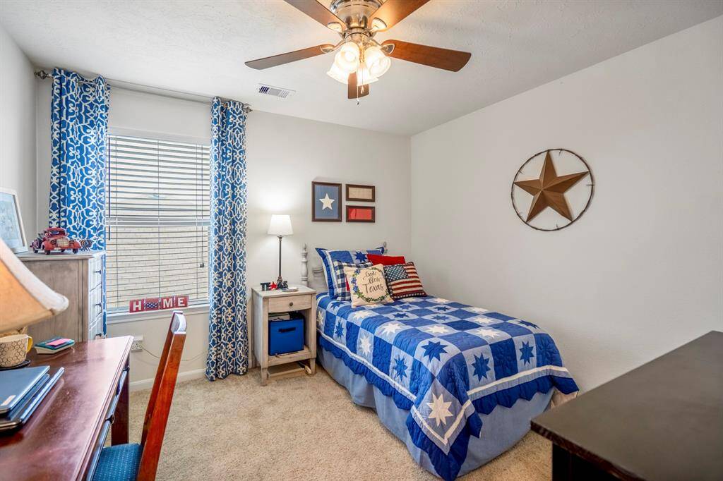 The other bedroom also has a light and fan combination. Along with large window for natural light.